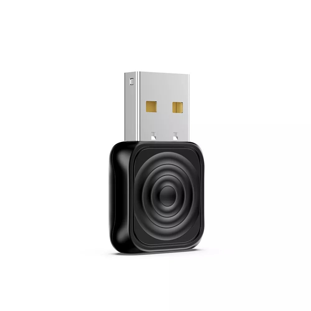 Carlinkit Mini Ultra adapter felülnézetből, USB-A csatlakozóval és gyűrűs mintázatú fekete házzal
